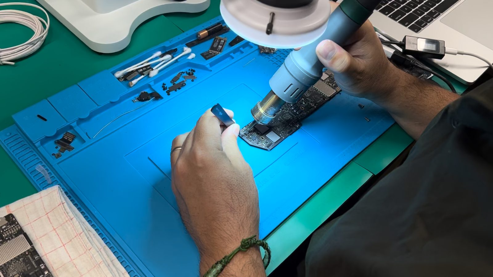 Board-Level Repair vs. Part Replacement on a Mac repair bench