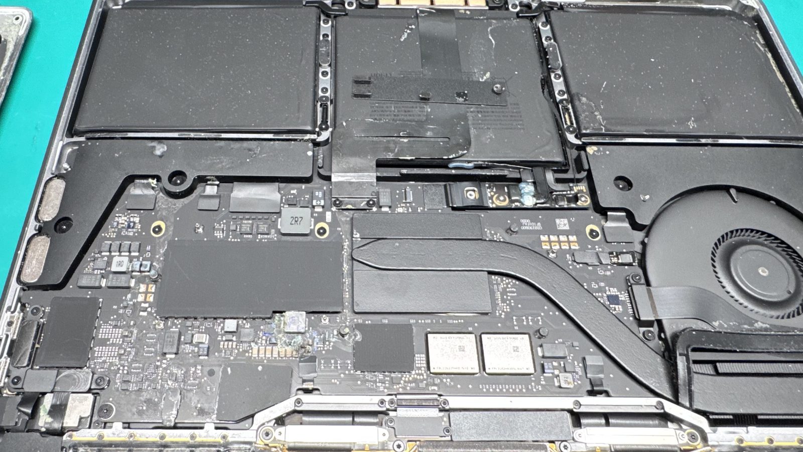 Liquid Damage & Corrosion on a Mac repair bench