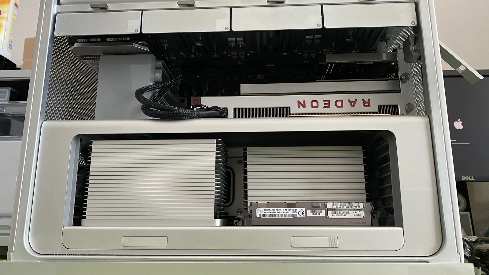 Inside of a Mac Pro at WarriorMac showing the graphics card, memory modules, and internal components during an upgrade