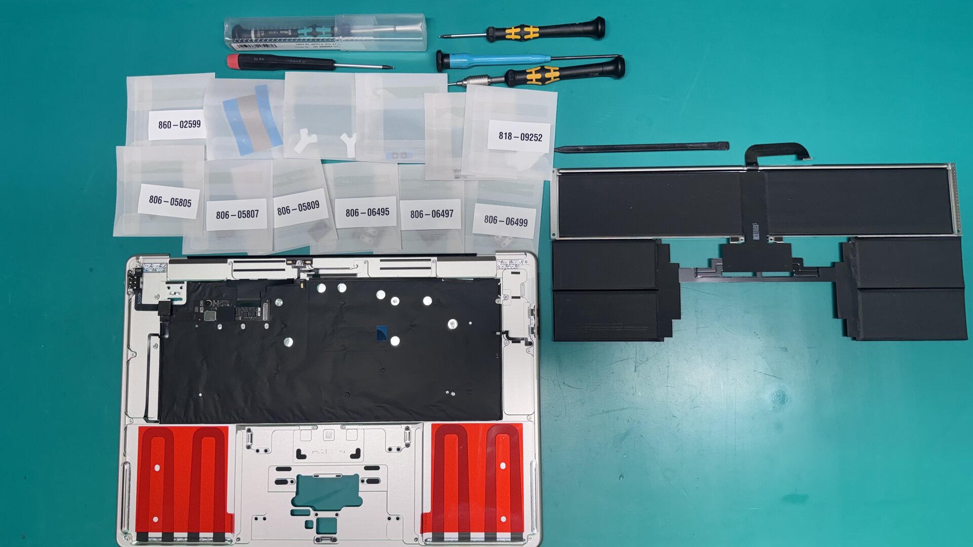 MacBook Battery Replacement, genuine Apple part being installed by a WarriorMac technician