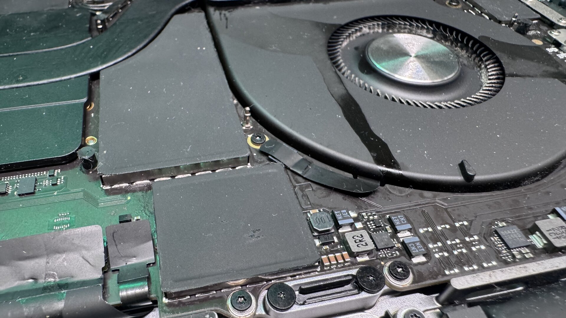 MacBook Water Damage Repair, genuine Apple part being installed by a WarriorMac technician