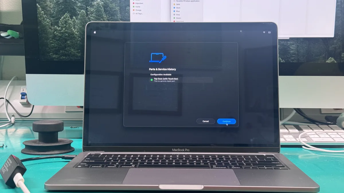 macOS Parts and Service History screen confirming a genuine Apple part after repair at WarriorMac