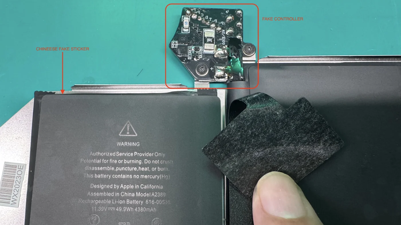Counterfeit MacBook battery showing a fake controller board and a fake warning sticker made to imitate a genuine Apple battery