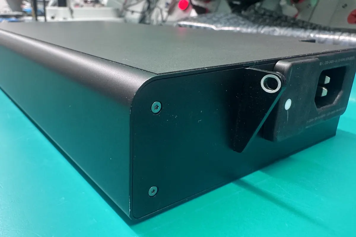 Mac Pro rear view showing power supply inlet and chassis on green workbench at WarriorMac Tampa