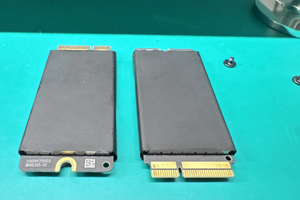 Mac Pro proprietary SSD modules removed on green workbench during data recovery at WarriorMac Tampa