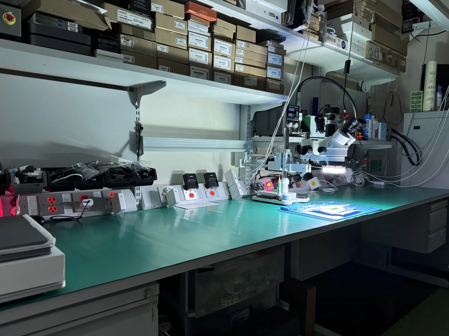 WarriorMac repair workbench with microscope and micro-soldering equipment in Tampa FL