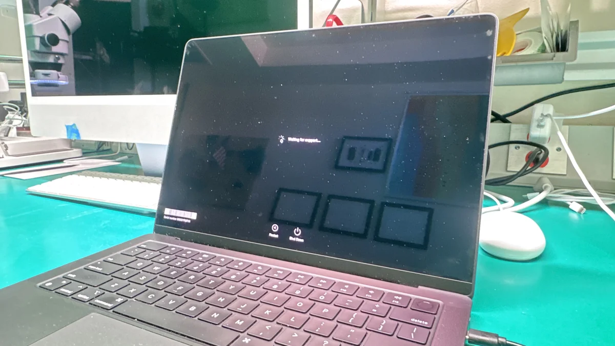 MacBook Pro 14-inch in DFU restore mode at WarriorMac repair bench