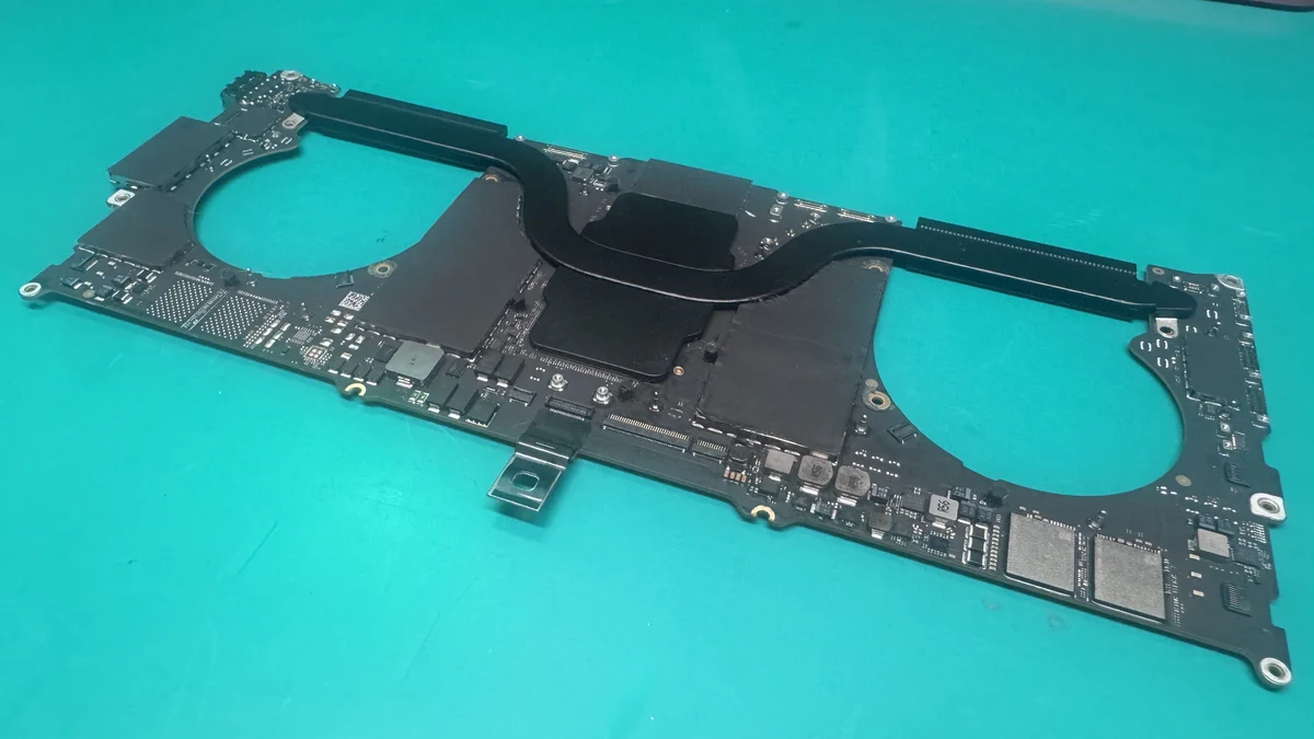 MacBook Pro 14-inch Apple Silicon logic board on ESD mat at WarriorMac