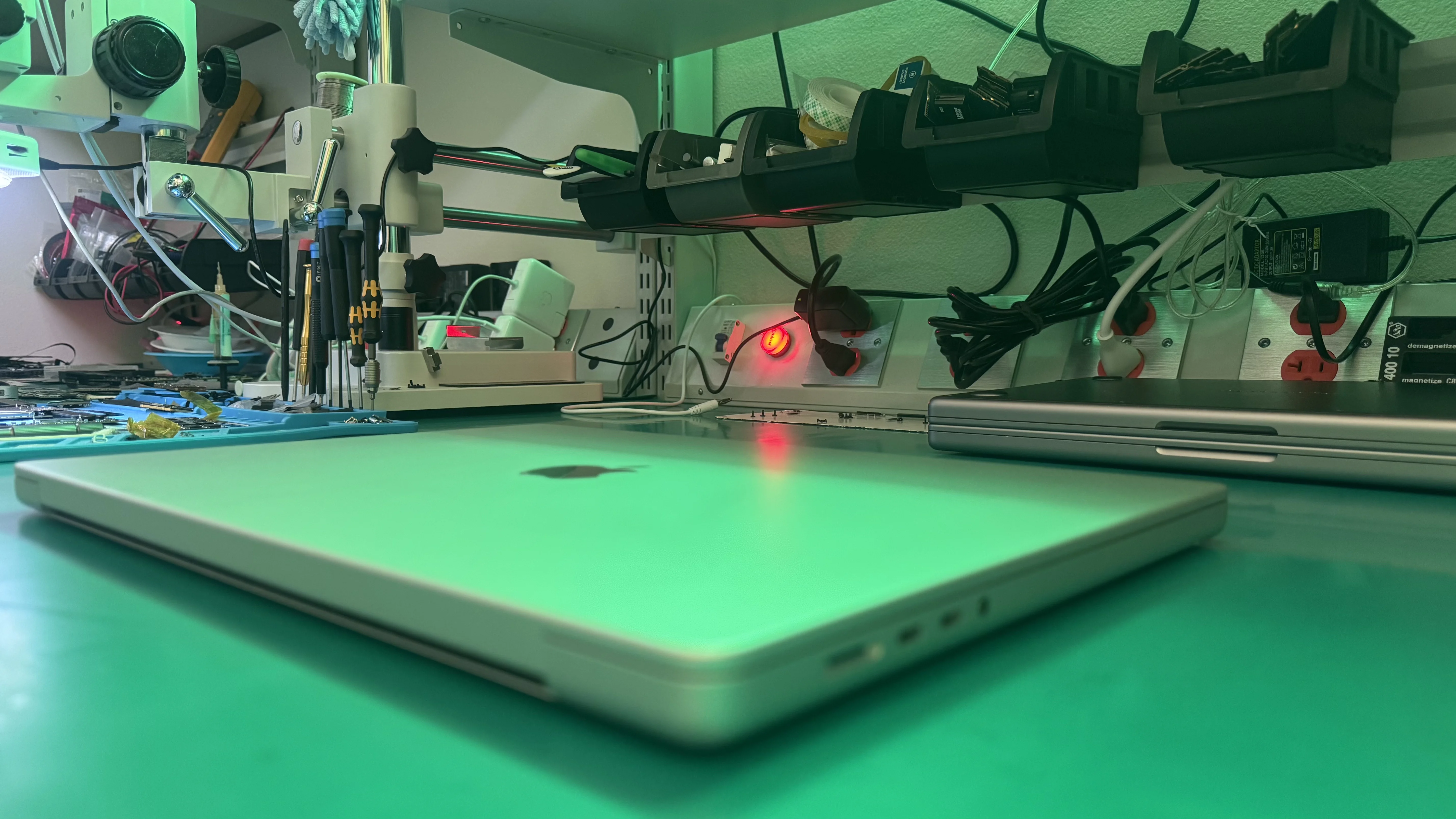 MacBook Pro on WarriorMac repair workbench in Tampa
