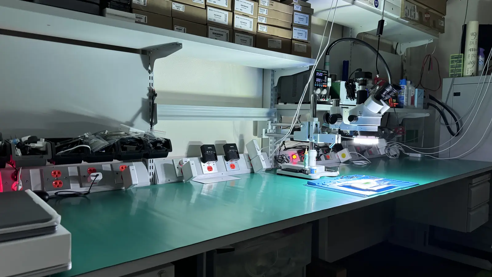 WarriorMac repair workbench with microscope and micro-soldering equipment for Mac Studio component-level diagnostics