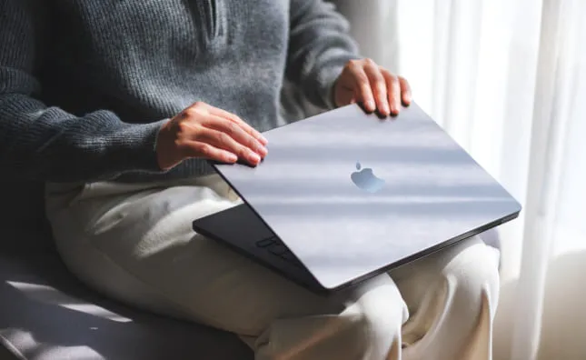 Reliable and affordable MacBook repair solutions at WarriorMac Tampa — person using MacBook