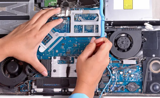 MacBook logic board repair at WarriorMac Tampa — component-level micro-soldering