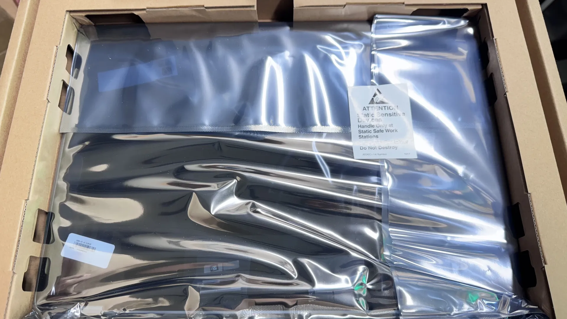 Genuine Apple OEM replacement screen in anti-static packaging